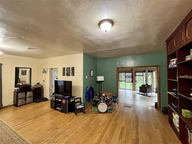 9967 Smith St, Lake City Borough, PA 16423 - living area with a textured ceiling and light wood finished floors
