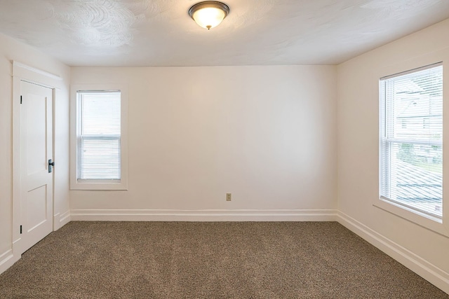 329 27th St, Erie, PA 16504 - carpeted empty room with plenty of natural light