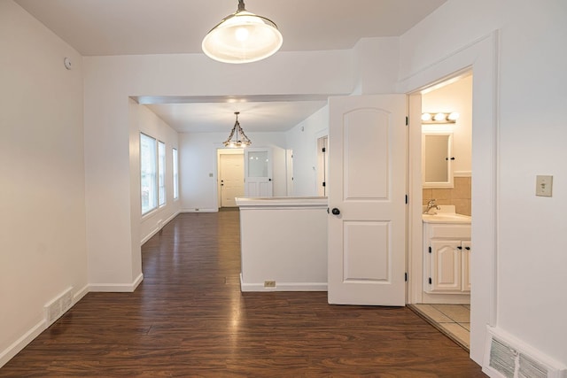 329 27th St, Erie, PA 16504 - hallway with dark wood-style floors and baseboards