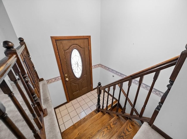 entryway with light tile patterned flooring