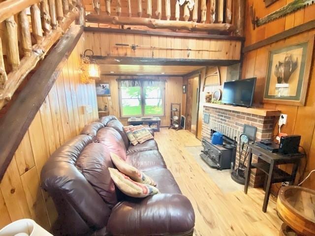 10634 N Edgewood Dr, Lake City Borough, PA 16423 - living room with wood walls, wood finished floors, and a towering ceiling