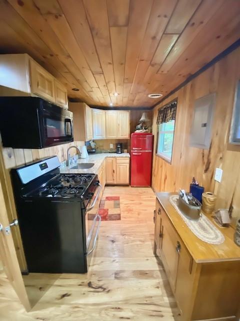 10634 N Edgewood Dr, Lake City Borough, PA 16423 - kitchen featuring stainless steel gas range, fridge, a sink, black microwave, and wood ceiling