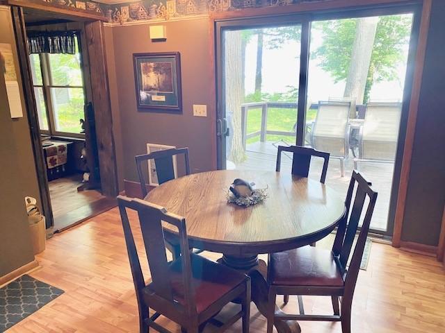 10634 N Edgewood Dr, Lake City Borough, PA 16423 - dining space with light wood-style floors and baseboards