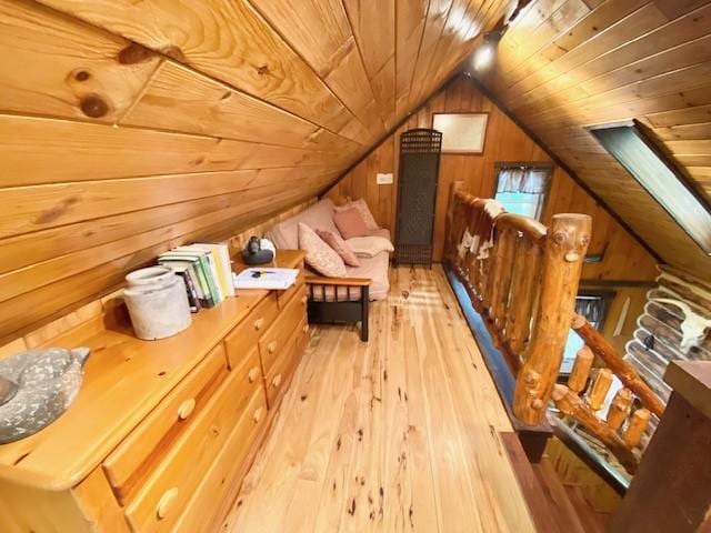 10634 N Edgewood Dr, Lake City Borough, PA 16423 - additional living space with wood ceiling, wooden walls, light wood-style flooring, and lofted ceiling