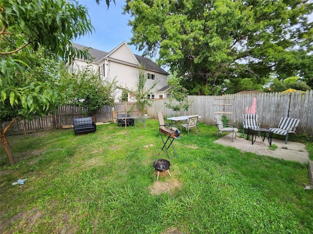 view of yard featuring a patio area and an outdoor fire pit