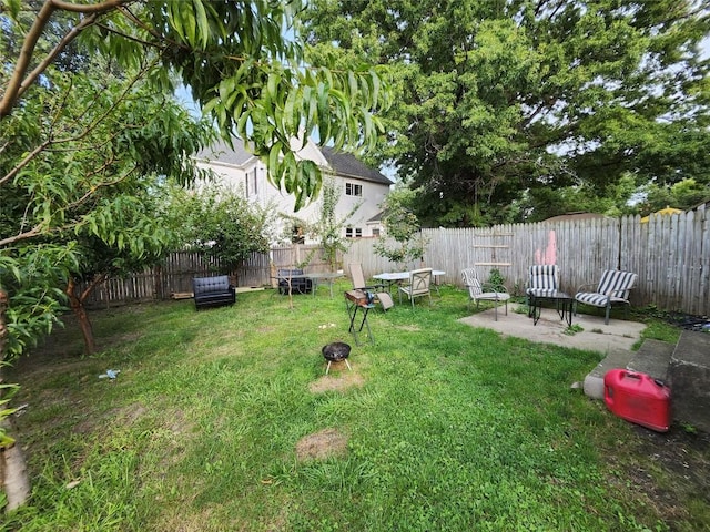 view of yard featuring a patio area and a fire pit