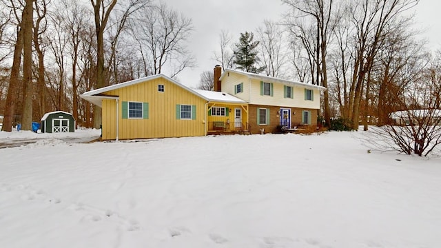 view of front of home featuring a shed