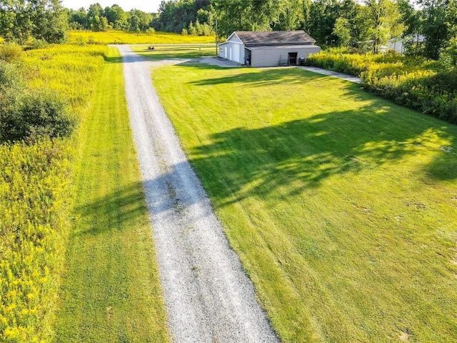 view of yard with an outdoor structure and a garage