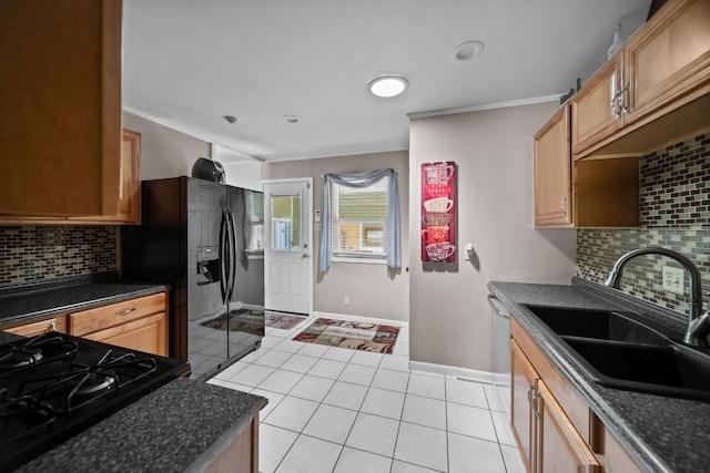 5243 W 53rd St, Fairview, PA 16415 - kitchen featuring dark countertops, decorative backsplash, light tile patterned floors, ornamental molding, and black fridge