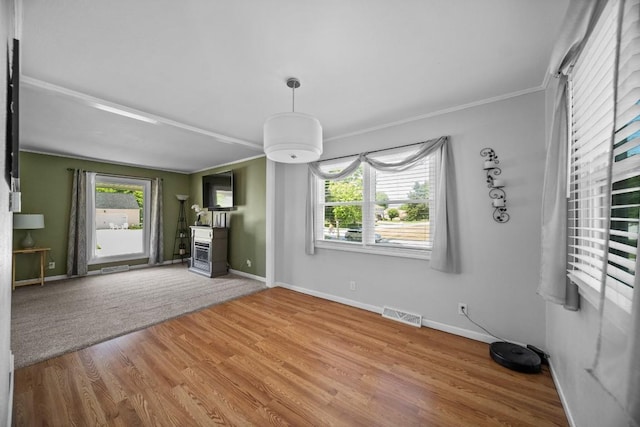 5243 W 53rd St, Fairview, PA 16415 - unfurnished living room with wood finished floors and crown molding