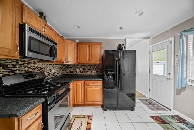 5243 W 53rd St, Fairview, PA 16415 - kitchen featuring stainless steel appliances, backsplash, light tile patterned flooring, brown cabinets, and ornamental molding