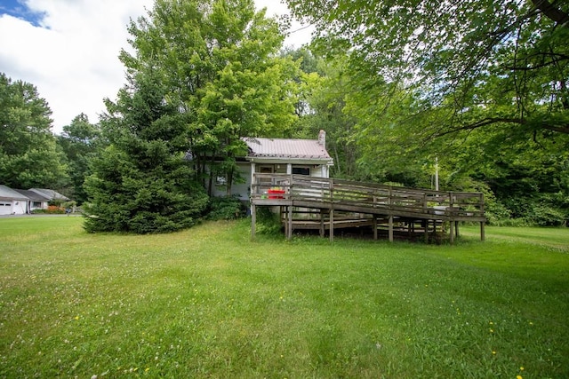 view of yard with a wooden deck