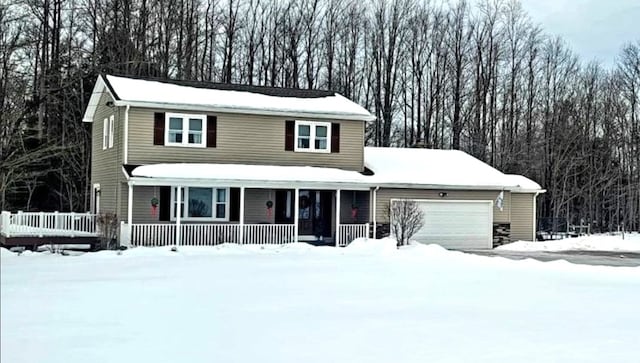 front of property featuring a porch and a garage