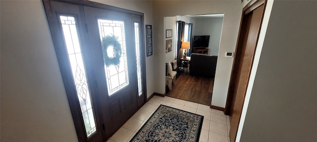 foyer featuring light tile patterned floors