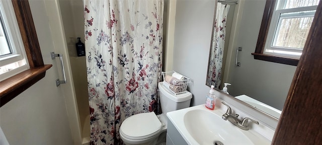 bathroom with vanity, toilet, and a shower with shower curtain