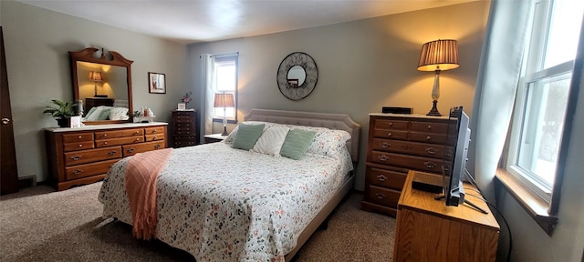 bedroom featuring dark colored carpet