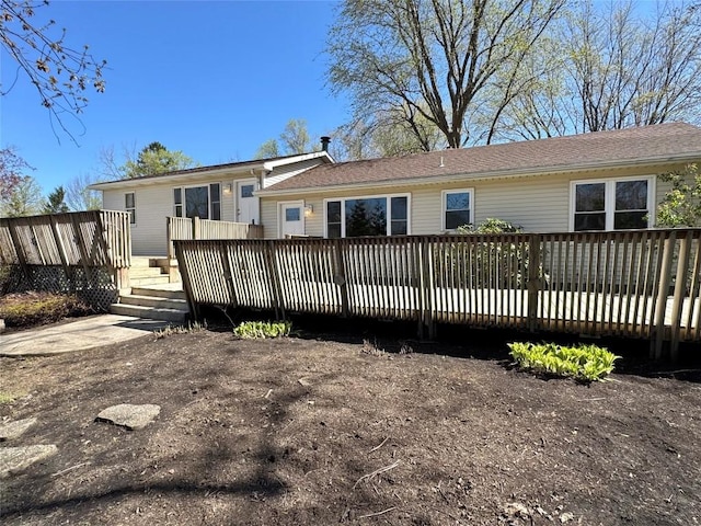 rear view of house with a deck