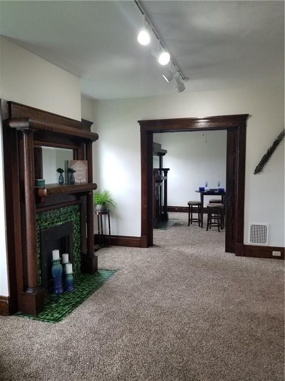 living room featuring carpet floors and rail lighting