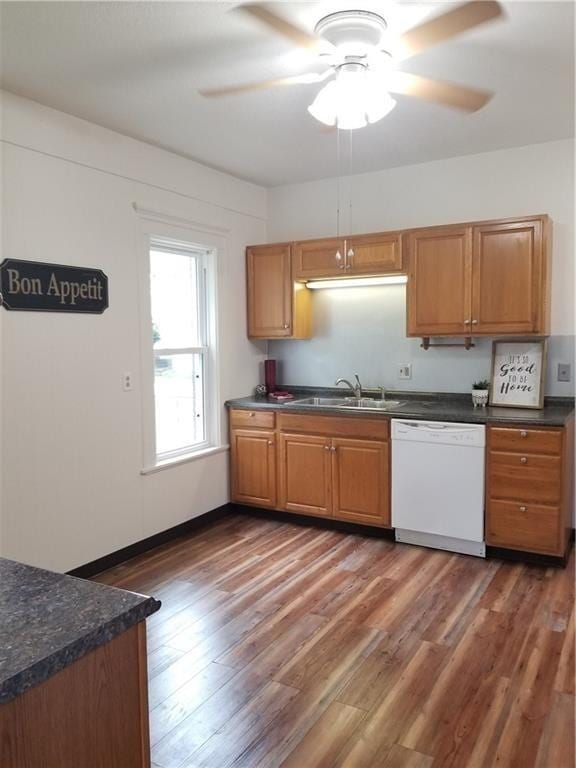 kitchen featuring dishwasher, ceiling fan, dark hardwood / wood-style floors, and sink