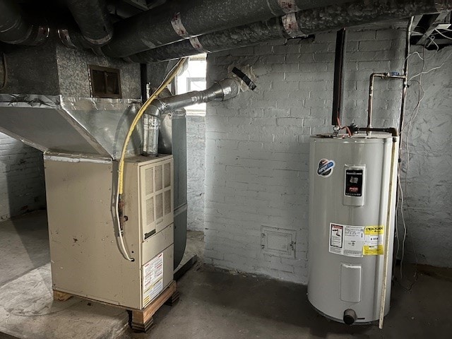 utility room featuring electric water heater