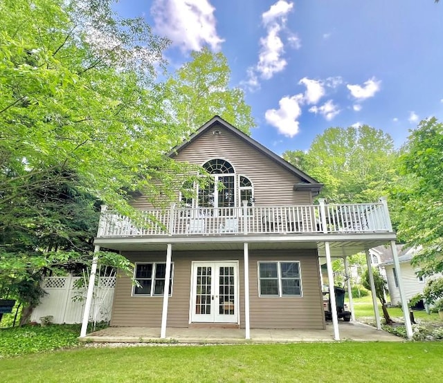 13478 Old Lake Rd Unit 62, East Springfield, PA 16411 - rear view of house with french doors, a patio, and a deck