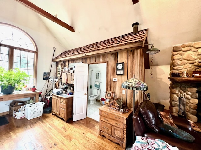 13478 Old Lake Rd Unit 62, East Springfield, PA 16411 - home office with high vaulted ceiling, light wood finished floors, and a fireplace
