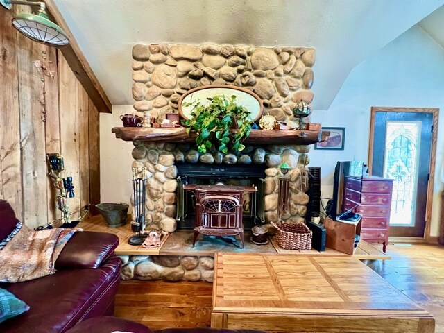 13478 Old Lake Rd Unit 62, East Springfield, PA 16411 - living area featuring wood finished floors, vaulted ceiling, and a wood stove