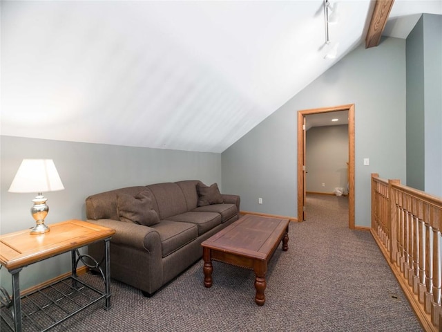 carpeted living area with lofted ceiling with beams and baseboards