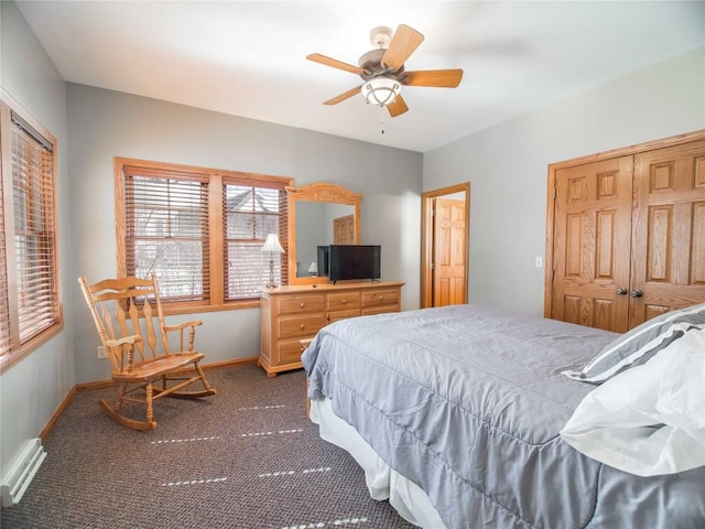 carpeted bedroom with ceiling fan, baseboards, visible vents, and a closet