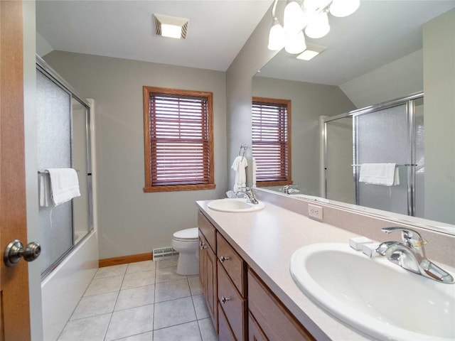 bathroom featuring double vanity, visible vents, toilet, and a sink