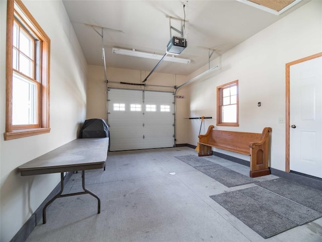 garage featuring baseboards and a garage door opener