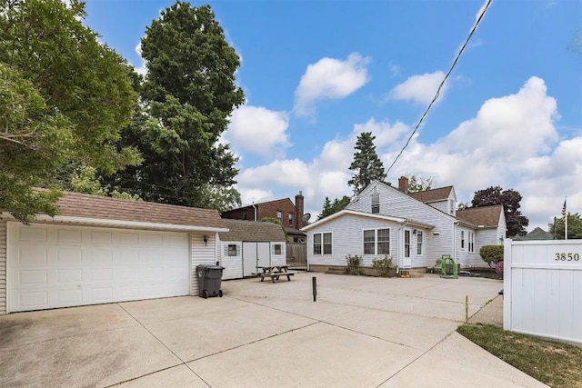 view of front facade with a garage and an outdoor structure