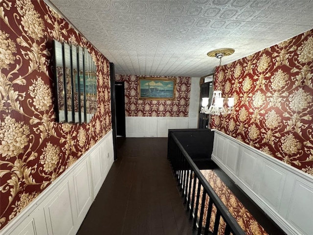 hallway with dark hardwood / wood-style floors