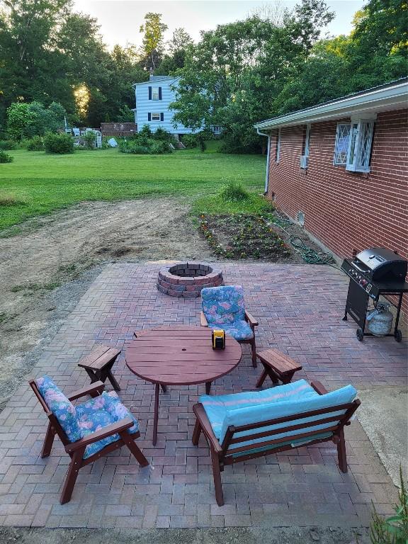 view of patio with a fire pit and grilling area