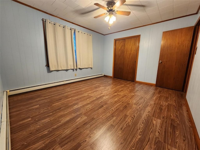 unfurnished bedroom with hardwood / wood-style floors, a baseboard radiator, ceiling fan, and ornamental molding