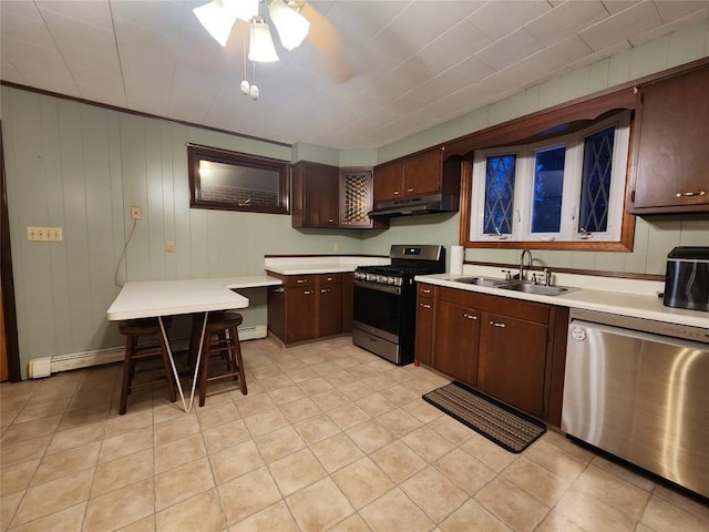 kitchen featuring dark brown cabinetry, ceiling fan, sink, and appliances with stainless steel finishes