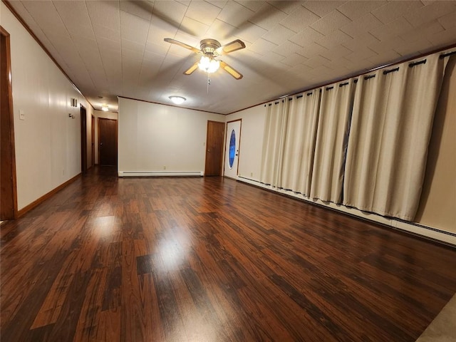 unfurnished room with ceiling fan, dark hardwood / wood-style flooring, and a baseboard radiator