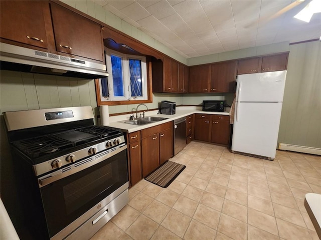 kitchen with dark brown cabinetry, stainless steel appliances, baseboard heating, sink, and light tile patterned floors