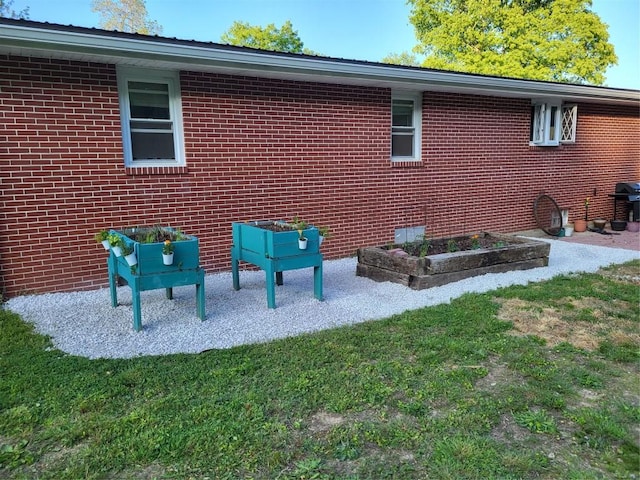 view of home's exterior with a yard