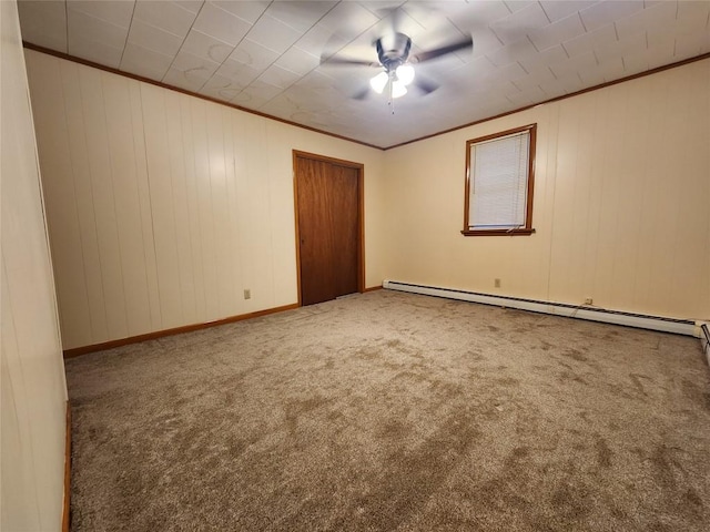 unfurnished room featuring ceiling fan, crown molding, carpet floors, and a baseboard radiator