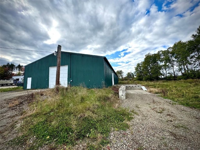 view of home's exterior featuring an outbuilding