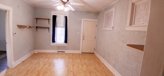 2677 Cherry St, Erie, PA 16508 - empty room with ceiling fan, crown molding, wood finished floors, and visible vents