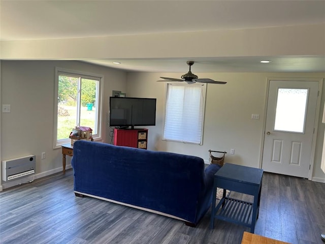 living room with dark hardwood / wood-style floors and ceiling fan