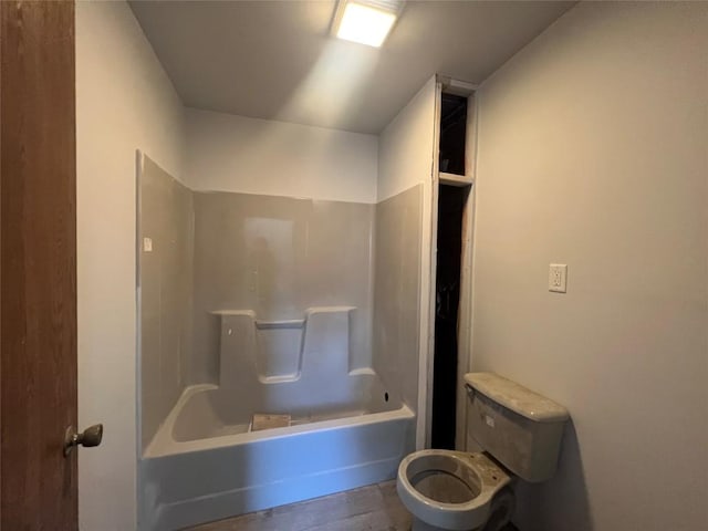 bathroom with shower / bath combination and toilet