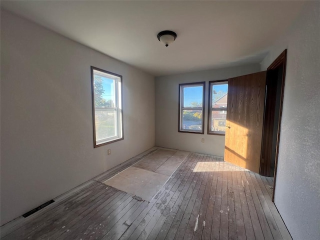 spare room featuring light hardwood / wood-style flooring