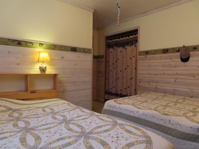 1900 Navaho Rd, Jamestown, PA 16134 - bedroom with wood walls, a wainscoted wall, and a closet