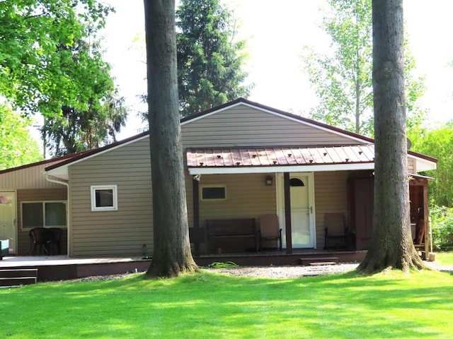 1900 Navaho Rd, Jamestown, PA 16134 - back of property with a lawn, a porch, and a metal roof