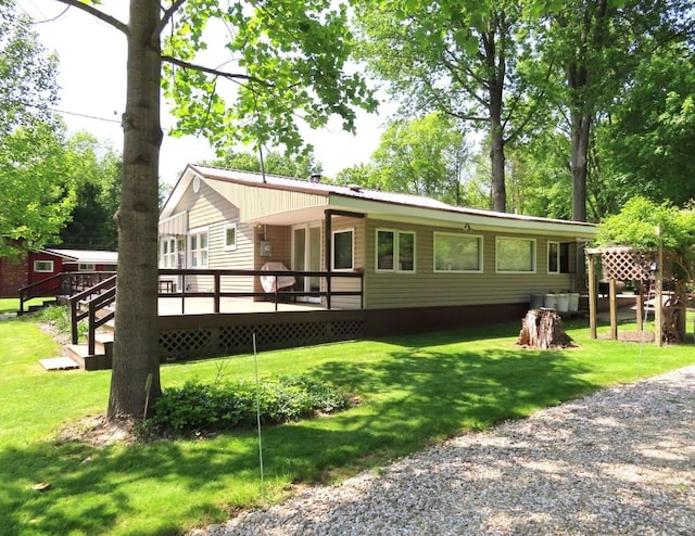 1900 Navaho Rd, Jamestown, PA 16134 - back of house with a wooden deck and a yard
