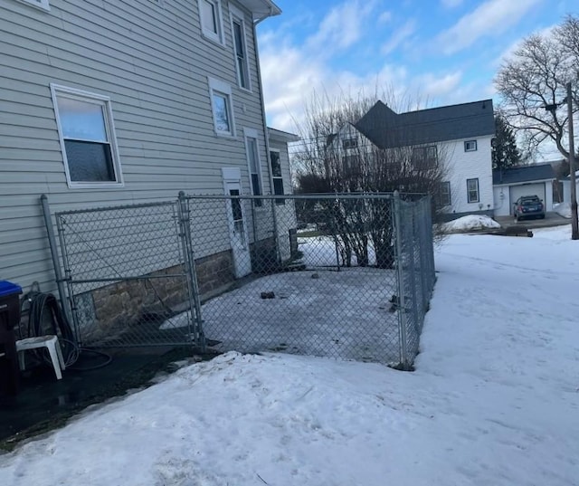 snowy yard with fence