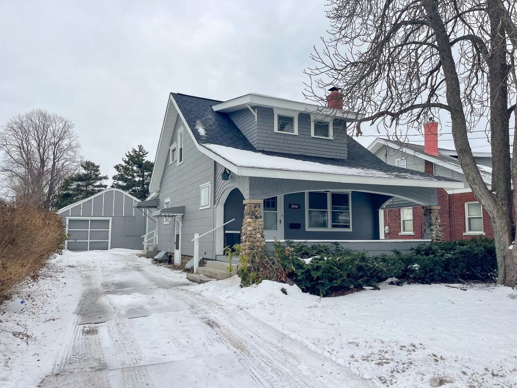 view of front of home with an outbuilding and a garage